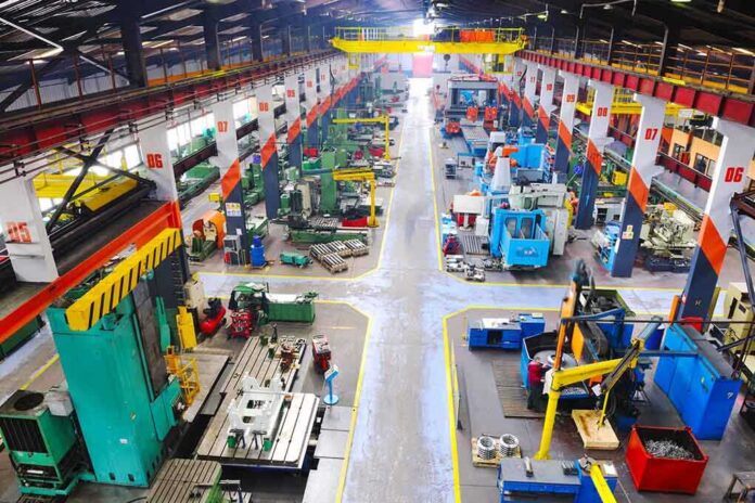 shutterstock_75131428-1 Aerial view of a large industrial workshop filled with various machinery and equipment