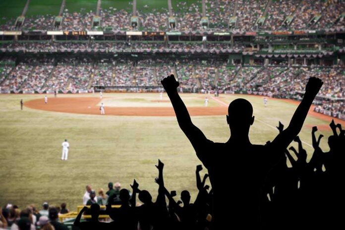 Fan,Celebrating,A,Victory,At,A,Championship,Baseball,Game. Crowd of fans cheering at a baseball game in a stadium