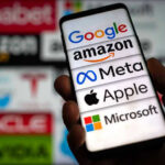 Tim Cook’s ‘Unavoidable’ Hike — What’s Missing? Hand holding phone displaying tech company logos