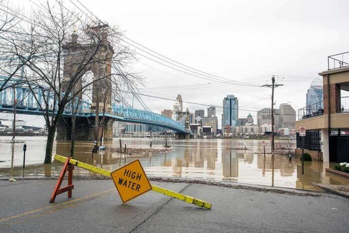 shutterstock_1032551206 Flooded riverfront with bridge and city skyline