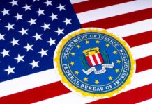 FBI Hiring Shift Raises Serious Questions FBI seal overlaid on the United States flag