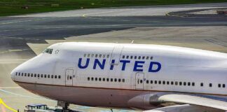 United Airlines Boeing 747 being towed on an airport taxiway