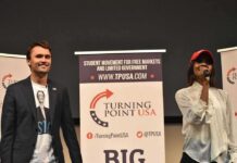 Trump Makes Charlie Kirk A National Figure Two speakers on stage at a Turning Point USA event
