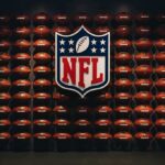 NFL Shock: Star Dies—Questions Explode NFL shield logo over wall of footballs