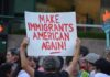Austin ICE Shooting Turns Political Teddy Williams at a protest holding a sign reading 'Make Immigrants American Again'