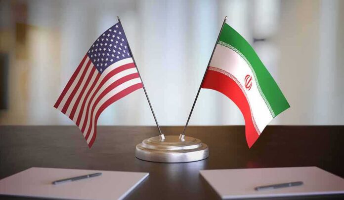 United States and Iran desk flags on a stand