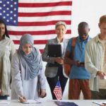 Voters standing in line at a polling station with a U.S. flag