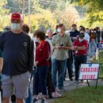 New Hampshire Governor Race Takes Shape Christian Jones and others waiting in a long line outside a polling place