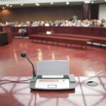 Appeals Bombshell Upends Elijah McClain Case Conference microphone on a podium in a courtroom