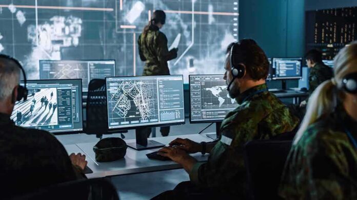 shutterstock_1936992973-10 Military analysts at computers in a command center