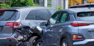 Two SUVs in a side-impact collision on a city street