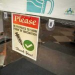 vaccination notice on a glass door