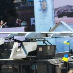Military drone mounted on armored vehicle