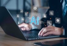 AI’s Biggest Risk May Be Human Hands typing on laptop with AI and tech icons overlay