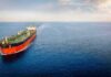 U.S. Tightens Air Defense Over Hormuz Oil tanker sailing on calm open sea