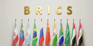 BRICS letters above a row of national flags on stands