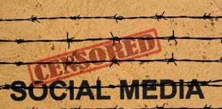 Barbed wire over the words social media and censored stamp