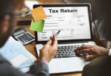 IRS Hammers OnlyFans Star Laptop displaying tax return form