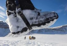 Terrifying 500-Foot Slide On Shasta Snow-covered boot steps across a snowy landscape