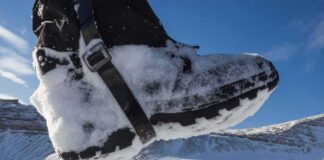 Snow-covered boot steps across a snowy landscape