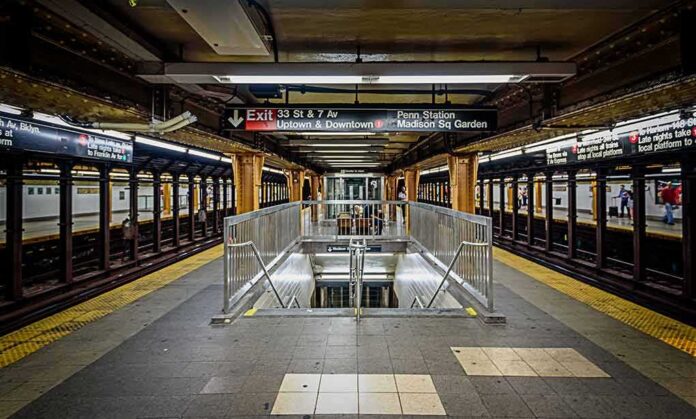Subway platform with stairwell and tracks on both sides