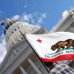 California Just Toughened Its DUI Laws California state flag in front of a white domed capitol building