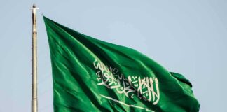 Saudi Arabia flag waving on a pole