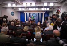 Bush’s Post‑9/11 Gambit: Not What You Think Press secretary at podium addressing reporters in briefing room