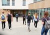 A Religious Liberty Lawsuit Forces School Policy Changes Students with backpacks walking toward a school entrance