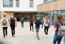 A Religious Liberty Lawsuit Forces School Policy Changes Students with backpacks walking toward a school entrance