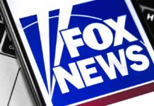 Fox News Signs a BIG One! Fox News logo displayed on a smartphone screen