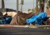 LA Fires: Promises Without Placements Street tents covered with tarps along a sidewalk