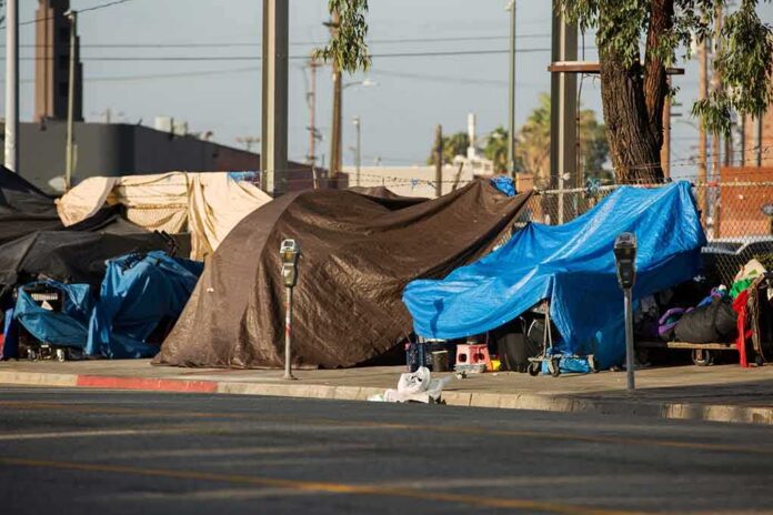 shutterstock_1495413719 Street tents covered with tarps along a sidewalk