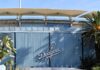 Dodger Stadium exterior with blue corrugated wall and palm trees