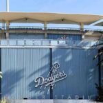 Dodger Stadium exterior with blue corrugated wall and palm trees