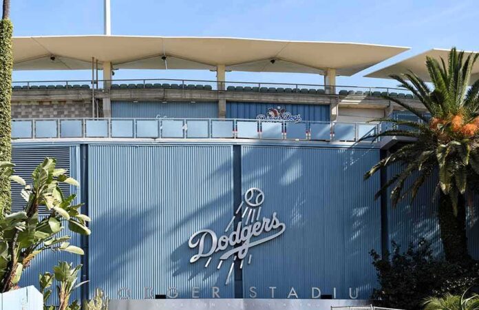 Dodger Stadium exterior with blue corrugated wall and palm trees
