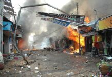 Nationwide Protests, Thousand-Plus Arrests Street marketplace engulfed in fire and heavy smoke