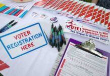 Latino Earthquake Upends L.A. Race Voter registration table with forms, pens, and informational materials