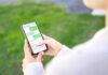 AI Excuse COLLAPSES in Guilfoyle Text Furor Person texting on a smartphone outdoors