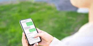 Person texting on a smartphone outdoors