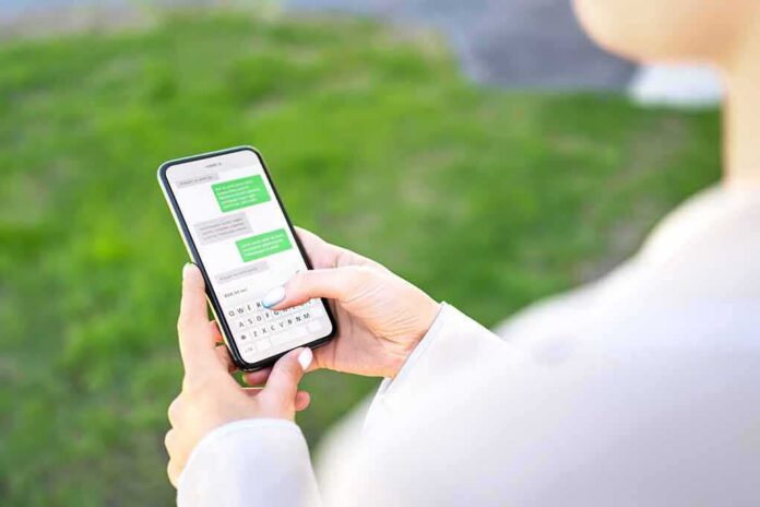 Person texting on a smartphone outdoors