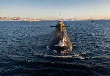 US Submarines Park In Australia – Why Now? Submarine cruising on cold open water toward camera