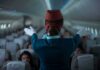 Hijack Code Triggers Fighter Scramble Flight attendant giving safety demonstration in airplane aisle