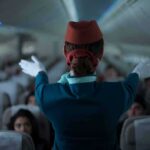 Hijack Code Triggers Fighter Scramble Flight attendant giving safety demonstration in airplane aisle