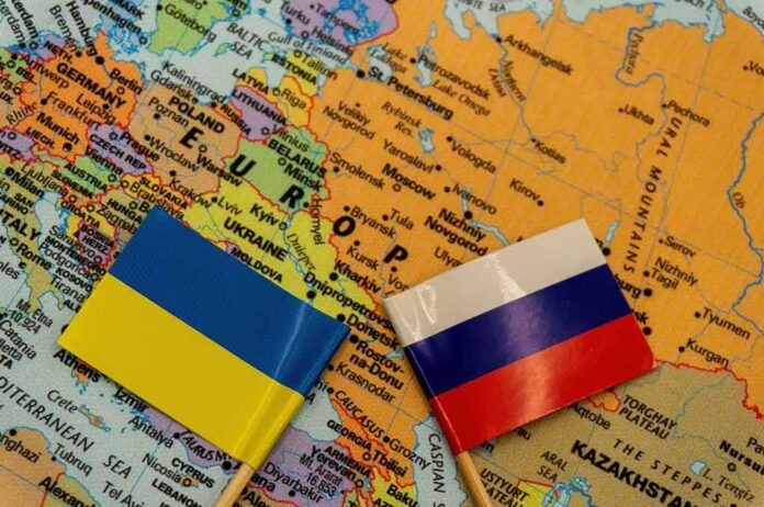 shutterstock_2109598166 Ukraine and Russia flags on a map of Eastern Europe