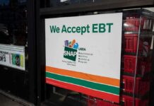 Atlanta Influencer Tied To SNAP Chaos storefront sign stating EBT accepted
