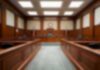 Mother’s Call Sparks Murder Case – Why So Fast? Empty courtroom with wooden benches and judge's bench