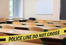 Teacher vs. Gunman – Classroom Chaos Flips Empty classroom with police tape across desks