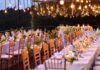 Pre-Wedding, Big Optics, Bigger Questions Elegant outdoor reception tables under hanging lights