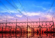 100 TWh Shock, Nowhere To Plug In Electrical substation with power lines at sunset